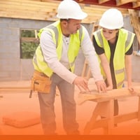 Mentor and student construction workers